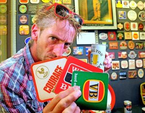 Rare beer coasters form bright display